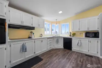 Make cooking and clean up more enjoyable with the natural light from large kitchen windows. The bright, airy space makes every mealtime a pleasure.