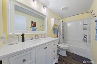 This main bathroom features stylish, modern updates creating a refreshing and contemporary space.