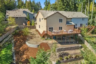 Newly landscaped backyard with terraces for outdoor living.