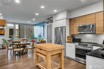 Open concept kitchen opens to dining and living area