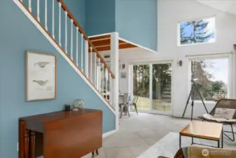 Vaulted ceilings lend style and a sense of spaciousness to this great room.