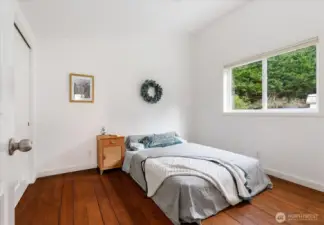 Second bedroom is spacious and has large closets on the left.