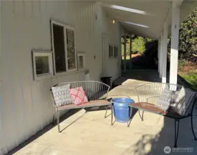 Covered patio is protected from the elements, yet has cleverly placed skylights which keep it bright!