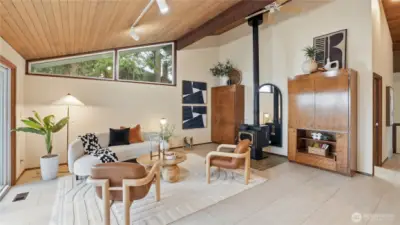 Custom built wood cabinets on both sides of the fireplace. Innermost cabinet is a wet bar.