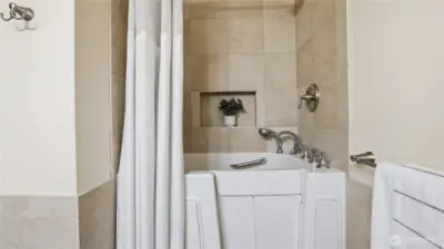 Full walk-in tub & radiant floor heating in Bathroom on basement level.
