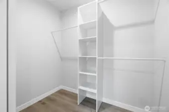 Primary walk in closet.