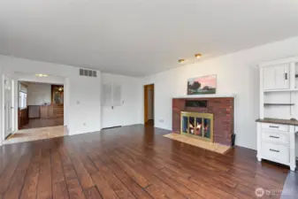 Living room with entrance to the dining room.