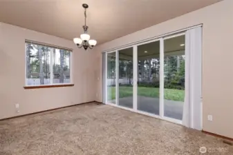 Dining area, with slider to the large backyard.
