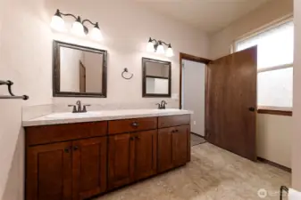 Primary bathroom with two sinks.
