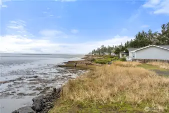 Gently sloping lower area leads to a beautiful beach setting.
