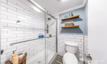 Primary bathroom with newer tile shower