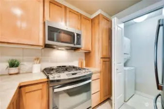 You can see the utility is conveniently located off the kitchen & there are wire shelving for additional pantry storage.