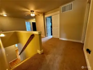 Upstairs landing with a large hallway.