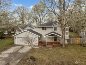 When your driveway is as long as this, you know parking won’t be a problem. The low-maintenance front yard keeps weekends free, while winter’s bare oaks create a dramatic silhouette framing this chic home’s facade.