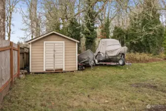 Need space for your boat, RV, or outdoor toys? This backyard has you covered with a handy garden shed and enough room to store it all (as long as it's behind the fence—thanks, HOA!). It’s the perfect setup for anyone who loves their toys as much as their backyard.