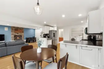 Between the breakfast bar, which has hidden storage (because we all need it), and the seamless transition from the kitchen to the dining area, this space screams practicality. Add a powder room beyond and living room in this open space, and you've got a layout that works hard for you.