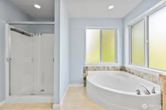 This divine primary bath features a soaker tub and walk in shower to start and end your day.