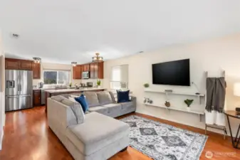 Open living main floor with laminate flooring.