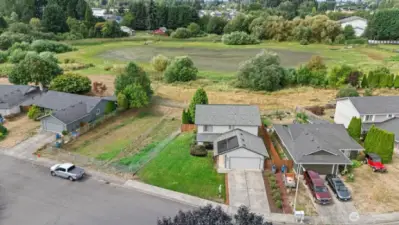 Aerial view of "summer" pond behind house