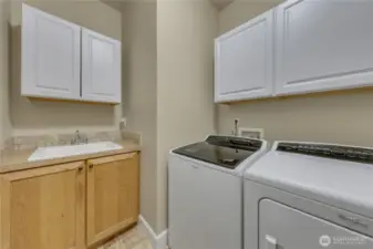 Downstairs laundry with lots of stroage.