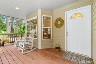 Cedar deck and a closed in ceiling - the front porch sets a welcoming tone.