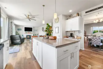 Elegant, bright, open concept kitchen with large center island, quartz countertops,luxury vinyl flooring,