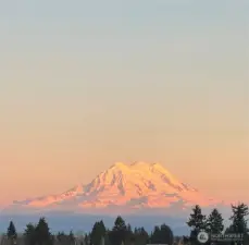Watch sunsets over the mountain from your backyard (this was taken from the back patio