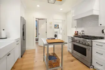 Stunning new kitchen with stainless appliances and natural gas range.