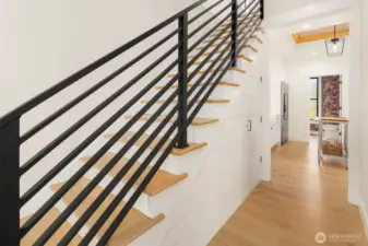 Thoughtful storage under the new stairs.