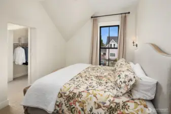 Primary bedroom with walk-in closet