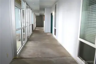 THE BUILDING HAS A COMPLETELY ENCLOSED MEZZANINE LEADING TO YOUR CONDO!