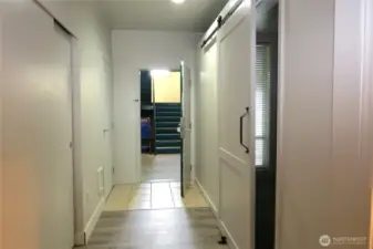 IN THE HALLWAY IS A FULL SIZED CLOSET ON THE LEFT AND BARN DOOR ENTRANCE TO THE BEDROOM!