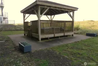 JUST OFF YOUR PATIO IS THE COVERED SPA/HOT TUB PAVILION!