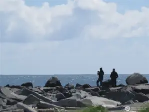 AT THE JETTY YOU CAN WATCH THE WAVES ALONG THE