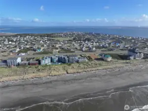 AERIAL VIEW OF OCEAN CREST AND IN THE BACKGROUND IS THE BAY WITH SHIPS GOING TO PORT!