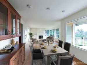 Dining room/living room, virtually staged.