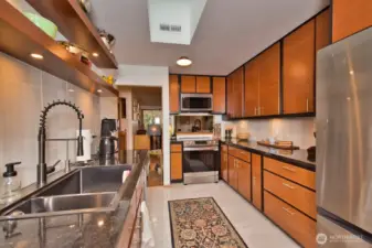 Custom cabinetry and clean lines make cooking in this kitchen a delight.
