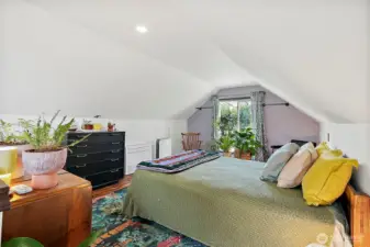 Half of the finished attic space turned into primary bedroom space.