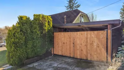 Carport off alley on N side of property.