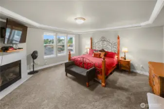 Moving upstairs, large primary bedroom with fireplace