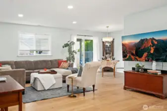 Semi open floor plan with hardwood flooring