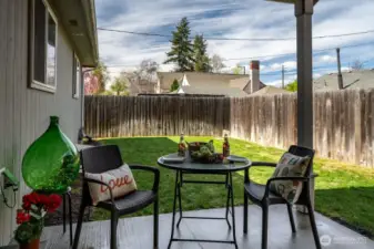 Covered patio with fully fenced yard