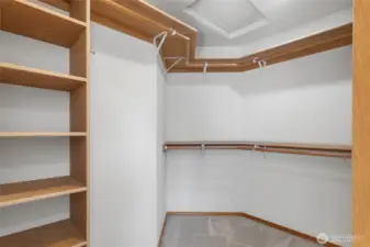 Walk-in closet in Primary Bedroom with plenty of space with built in shelves.