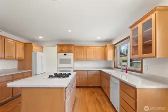 Another view of the kitchen with tons of cabinet and counter space.Double ovens for the true Chef.