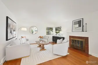 Cozy living room with wood burning fireplace.