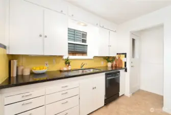 Cheery kitchen with access to the side yard.