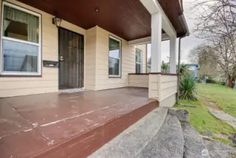 Step onto the large covered front porch overlooking Angel Place.