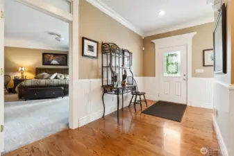 Main level entry with Primary bedroom to left.