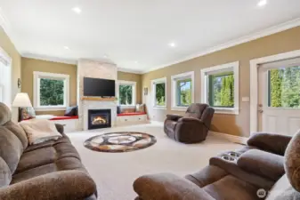 Spacious family room with windows to the beautiful vies and gas fireplace for clean and cozy warmth.