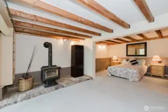 Downstairs bedroom w/ wood burning fireplace
